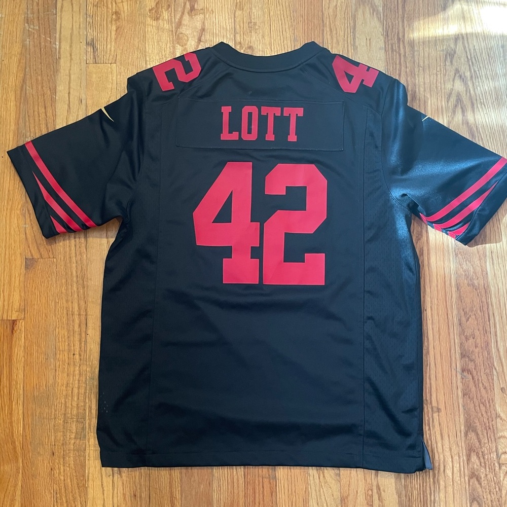 Large Ronnie Lott black and red 49ers jersey